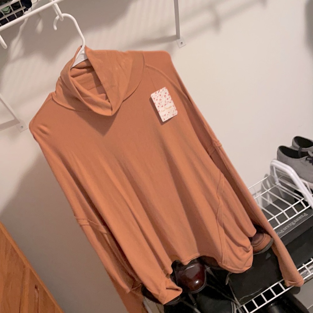 Free People. Long sleeved top. Size S. Brand new!